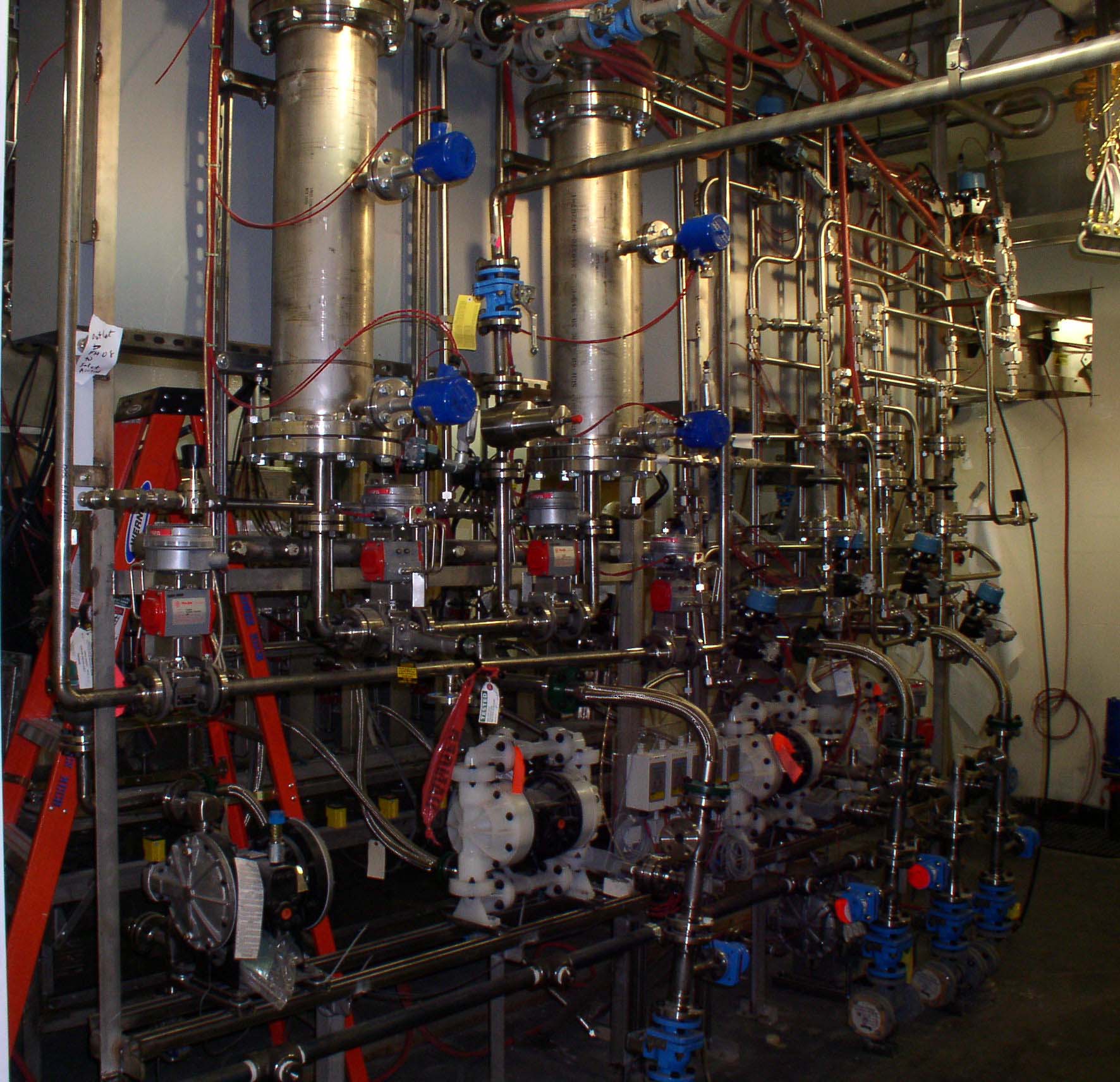 Field installation of Hastelloy piping in a punch and drain room
